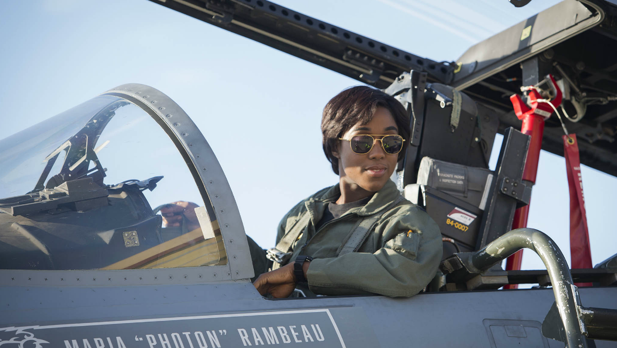 Lashana Lynch as Maria Rambeau sitting in a jet in Captain Marvel