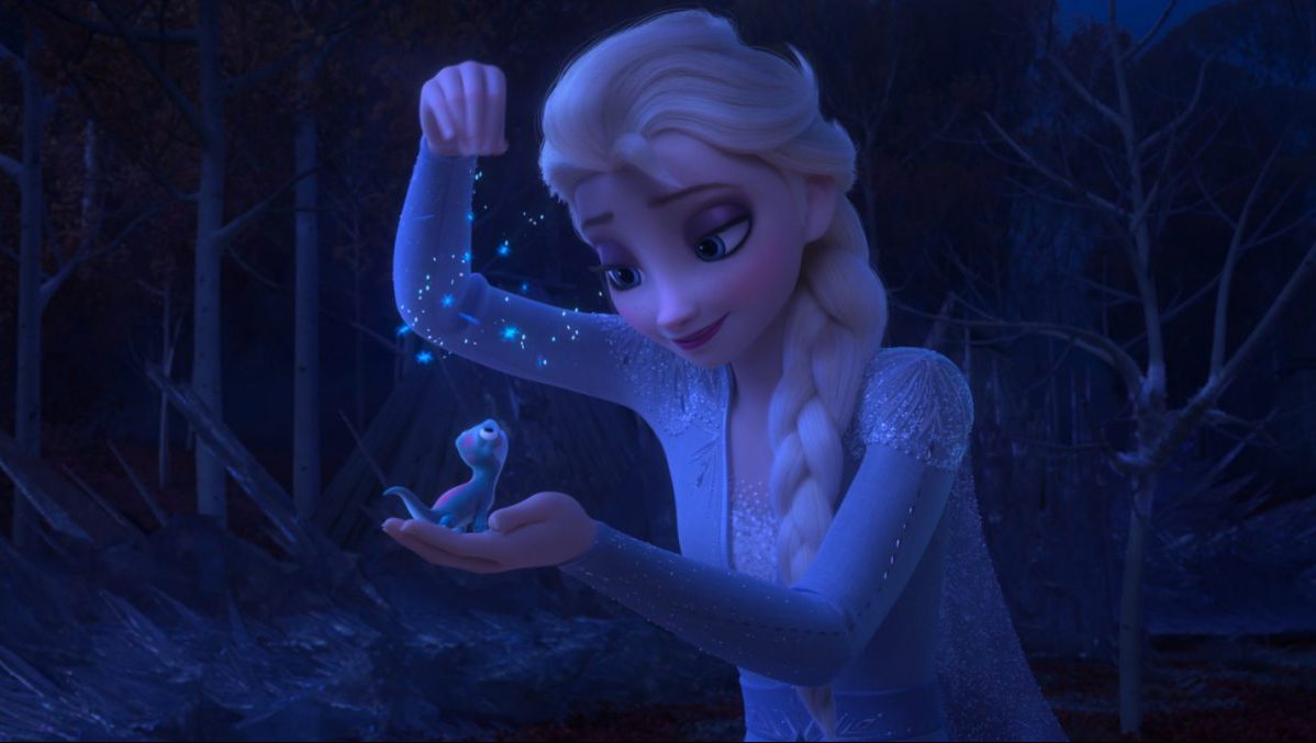 Elsa befriending Bruni the salamander in Frozen 2.