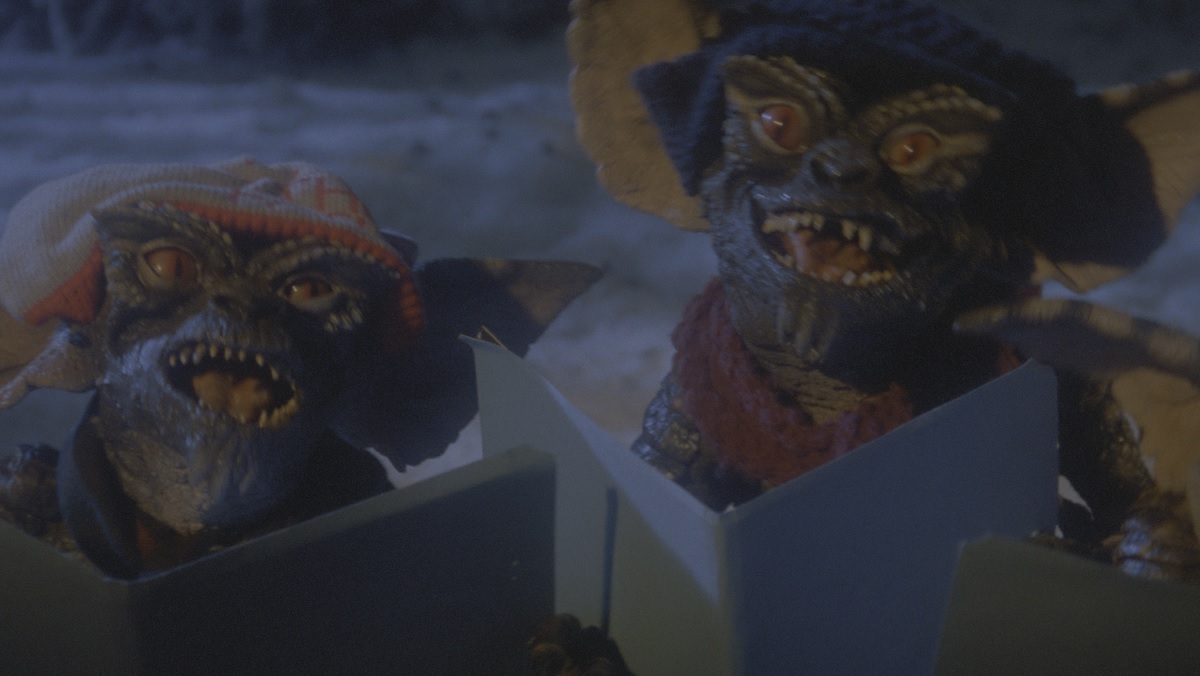 Gremlins singing Christmas carols.