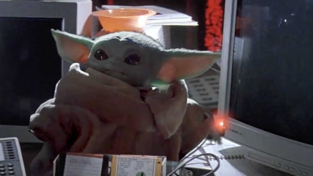 Baby Yoda turning on a computer in Jurassic Park