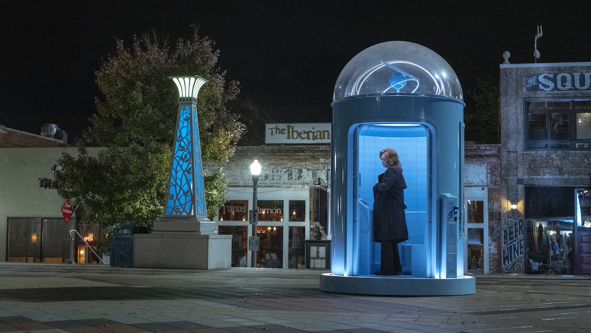 Laurie Blake stands in a Manhattan telephone booth