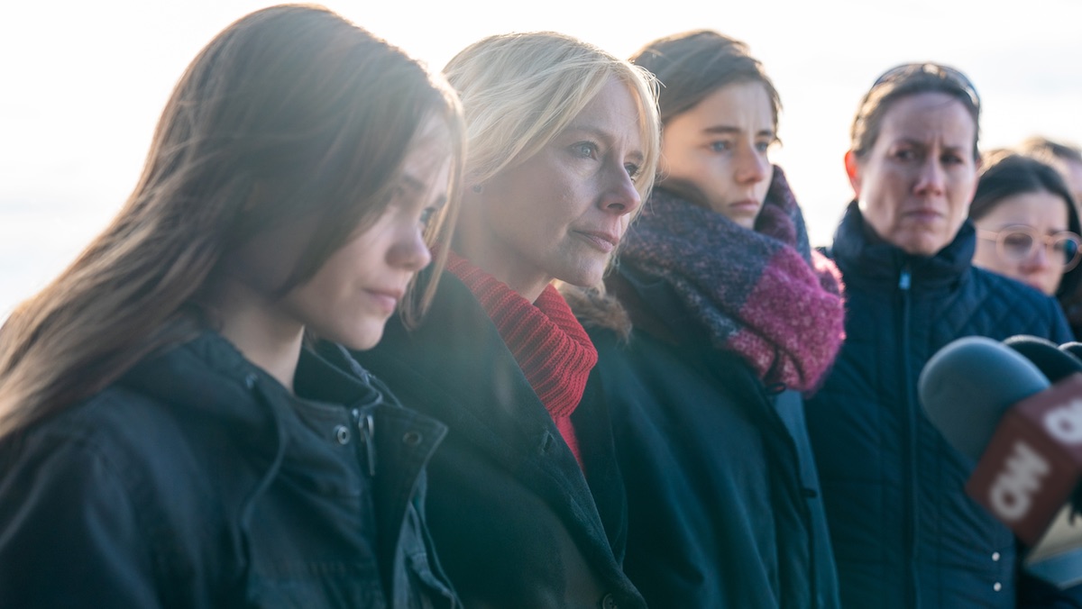 Amy Ryan and others hold a press conference in Lost Girls