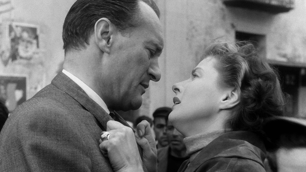 George Sanders and Ingrid Bergman grasp at one another in a scene from Journey to Italy.