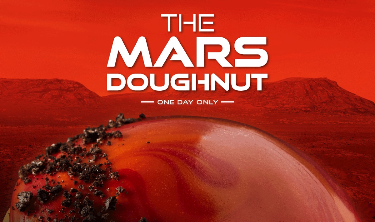 Half of Krispy Kreme's Mars Doughtnut below text with the name, all set against a background of Mars