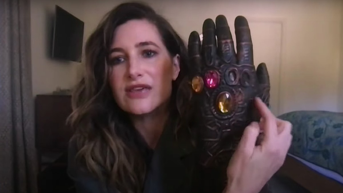 Kathryn Hahn holds up a toy Thanos glove in a clip from Late Night with Seth Meyer.