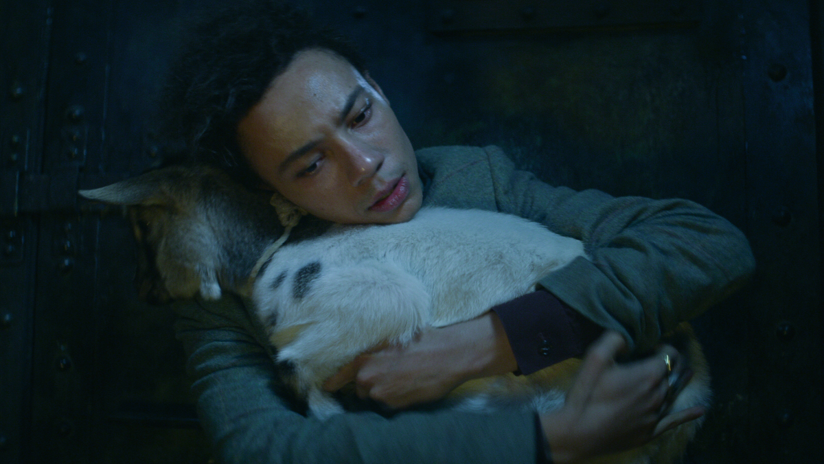 Jesper hugging a goat in Shadow and Bone