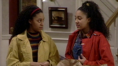 photo of tia and tamera mowry standing on the set of sister sister sitcom theme songs