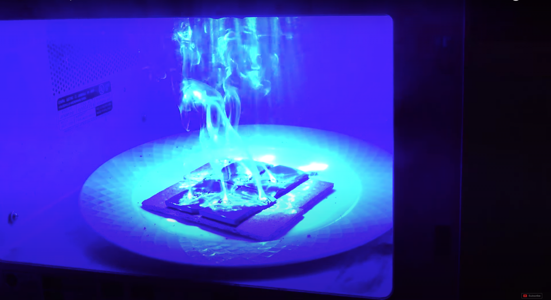 A 700-watt laser oven blasting some s'mores with its brilliant, bluish-white lasers.