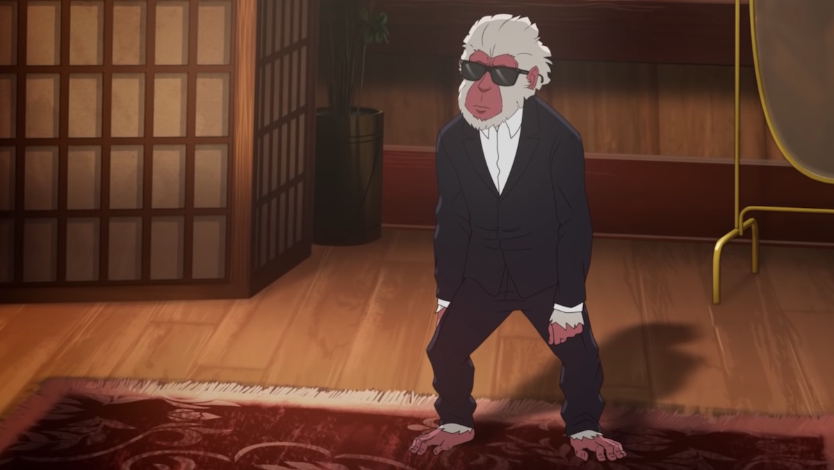 A snow monkey looks like Rain Man in a black suit, white shirt, and sunglasses on Hulu's Hit-Monkey