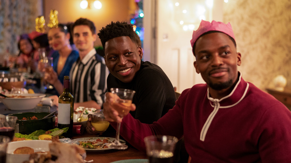 Sam Obisanya and Richmond players sit around a table wearing Christmas crowns