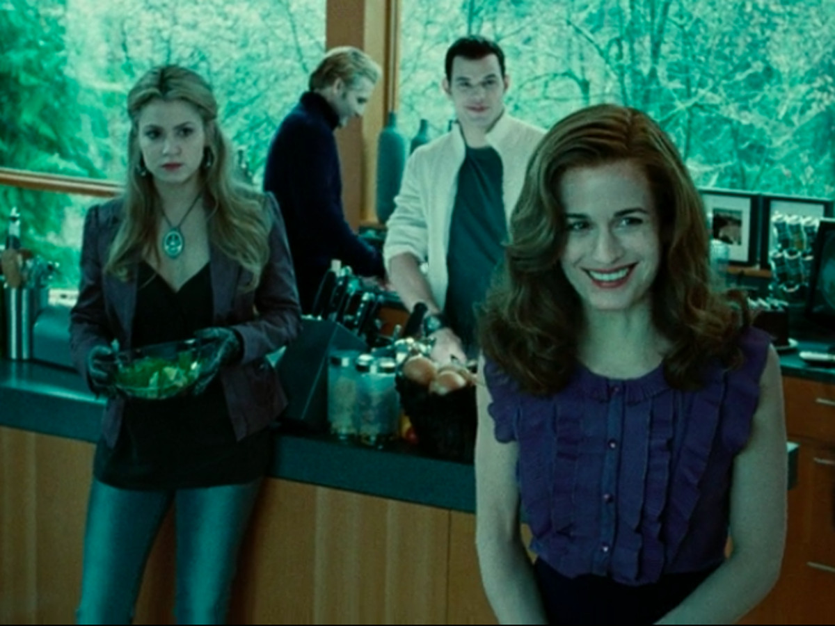 A group of vampires stand in a kitchen in Twilight