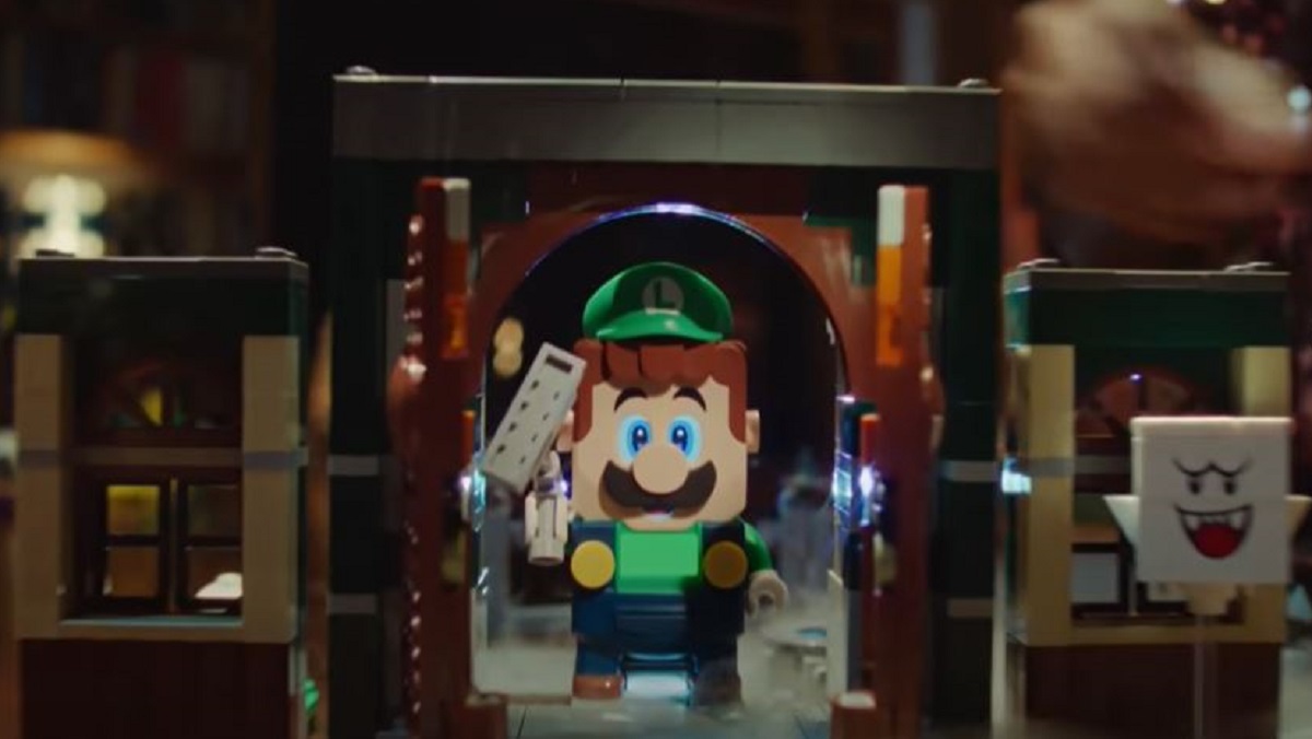 Luigi holding his ghost catching Poltergust from the LEGO Mansion set.