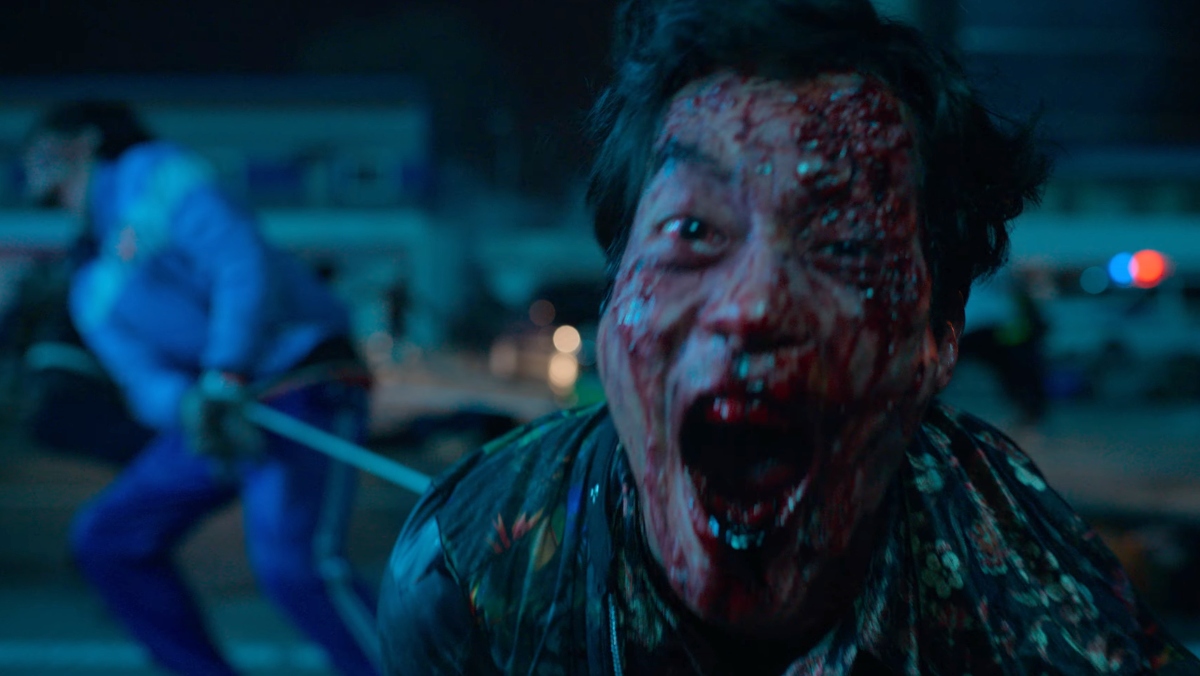 a man screams into camera with a bloody face in all of us are dead trailer