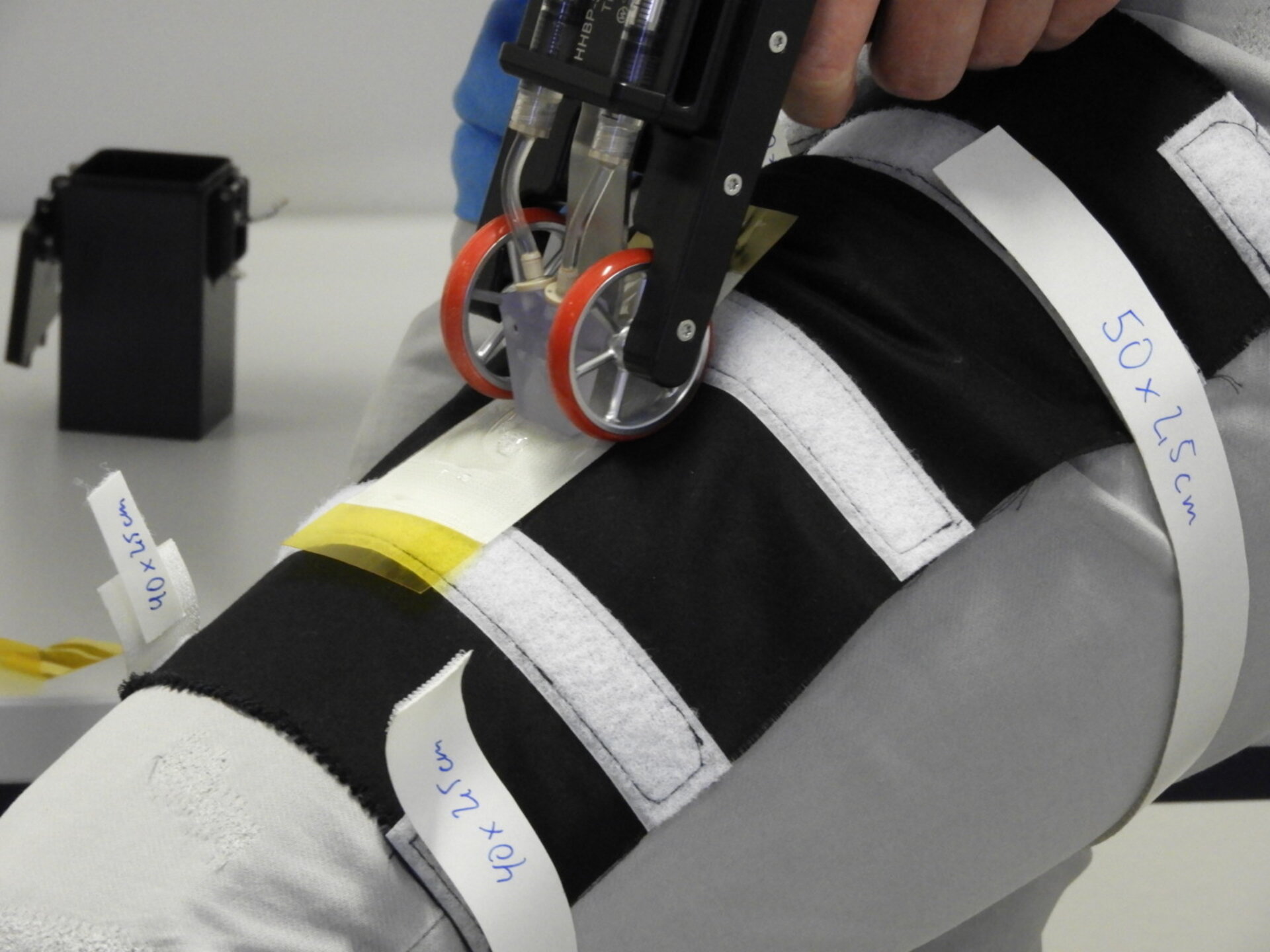 An ESA astronaut showing off a bioprinter for first aid in space.