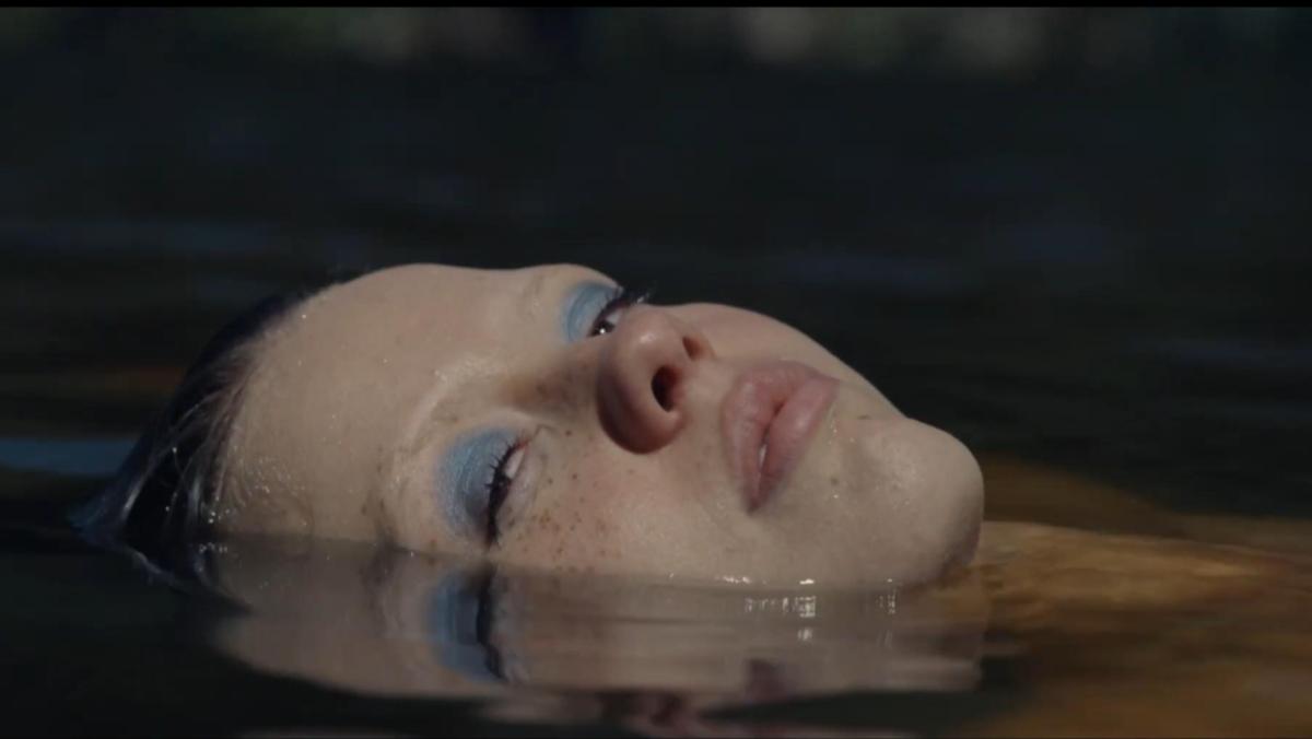 An image from X shows Mia Goth as Maxine laying submerged in water her face poking out