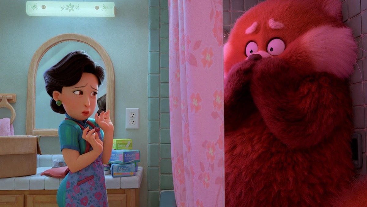 Mei, a tween girl whose embarrassment turns her into a giant red panda, hides in the shower from her mom in the Disney-Pixar movie Turning Red.