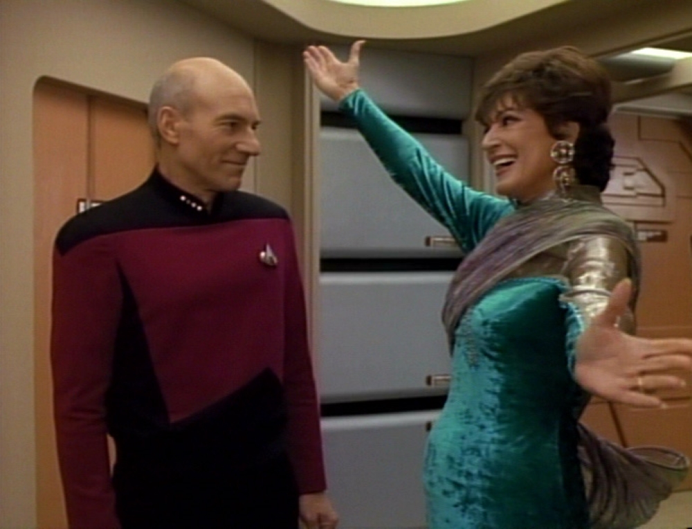 Lwaxana Troi greets Captain Picard in an episode of Star Trek: The Next Generation