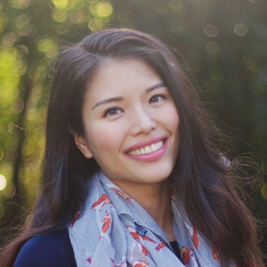 An image of the author shows an asian woman with long brown hair wearing pink lipstick smiling wide