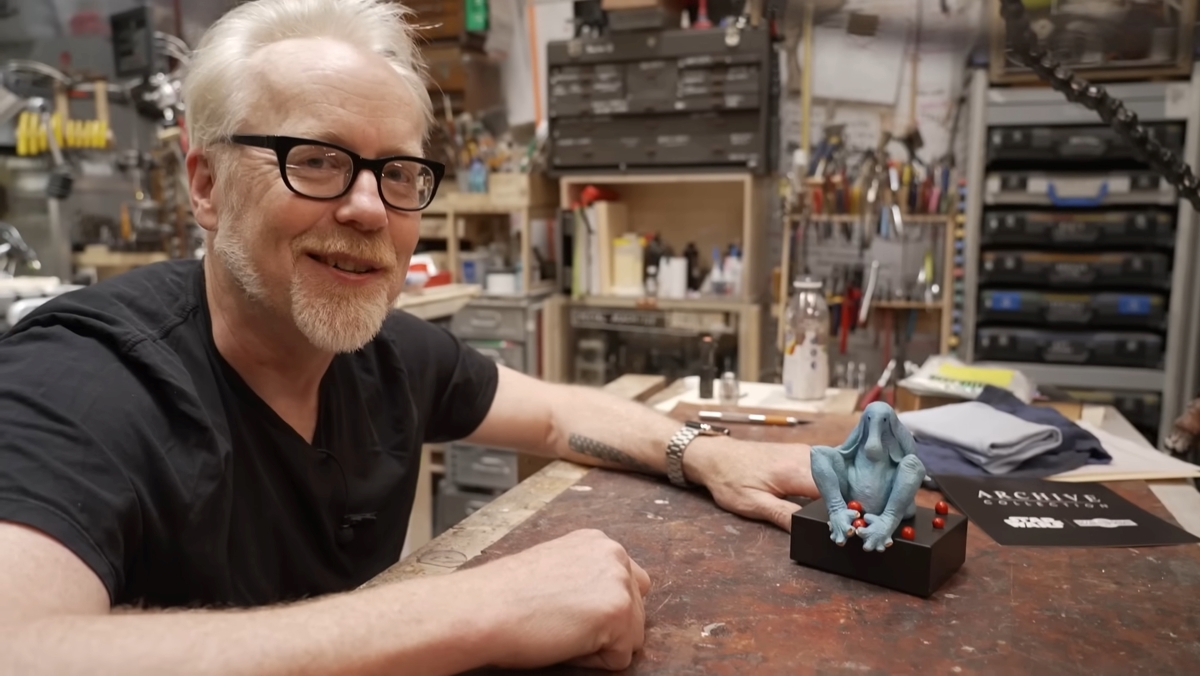 Adam Savage showing a Max Rebo statue in his workshop