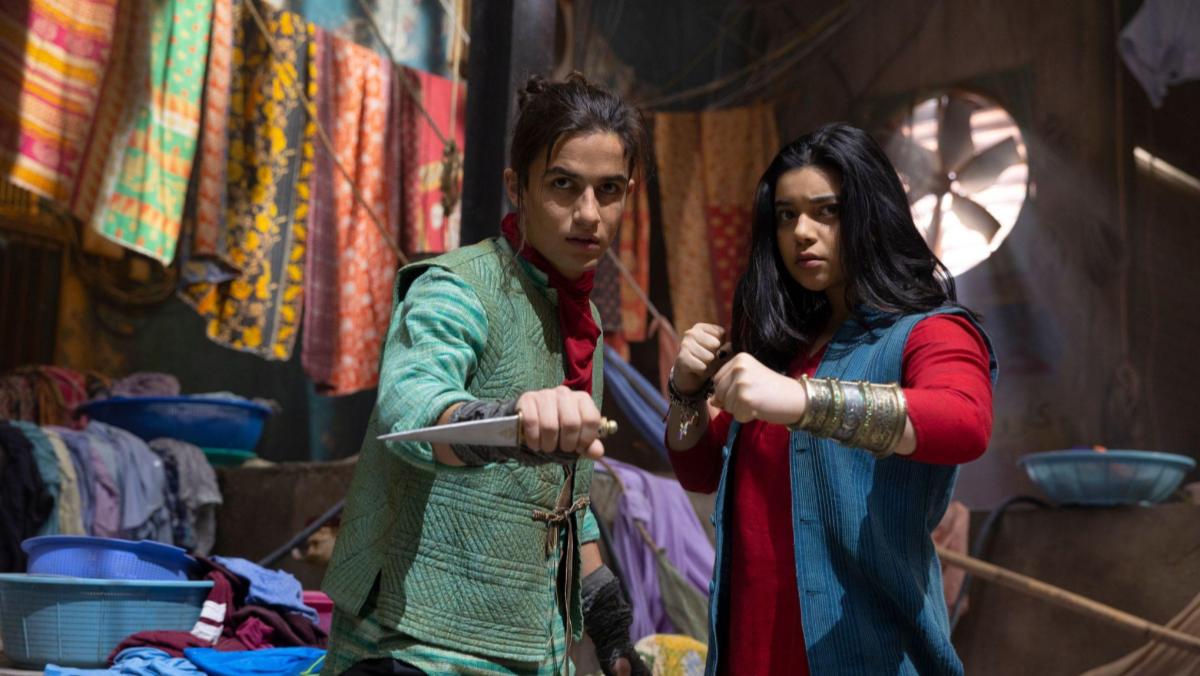 A still from Ms. Marvel shows Kareem AKA the Red Dagger and Kamala Khan as Ms. Marvel standing in Karachi in superhero poses