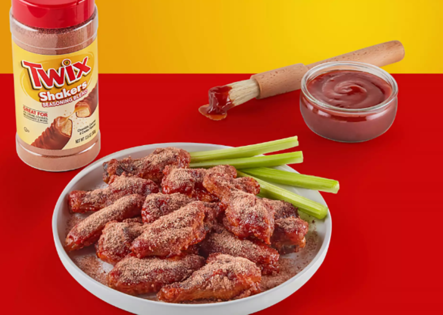 Twix-flavored seasoning next to a bowl of chicken wings with BBQ sauce made from the brand's recipe