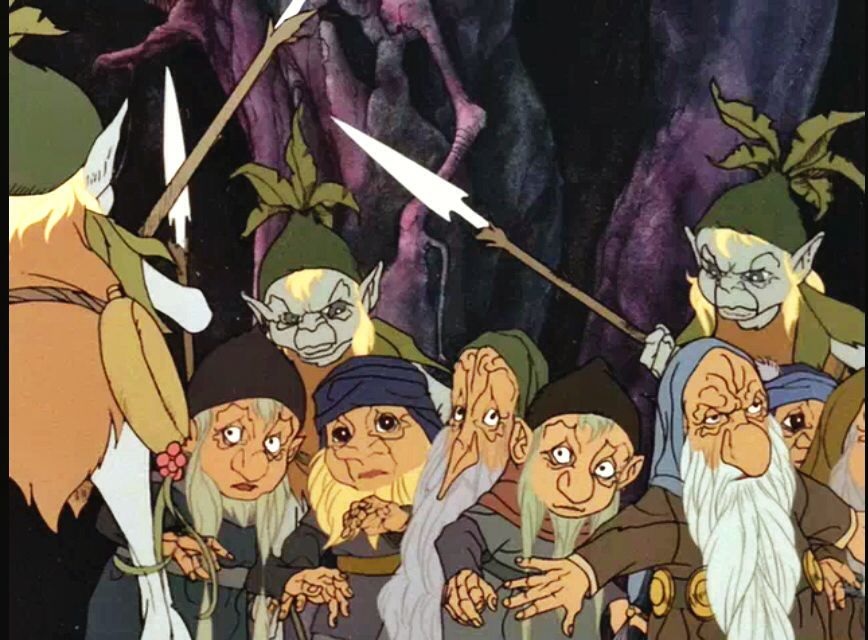 A trio of grotesque wood elves surround the dwarves in The Hobbit.