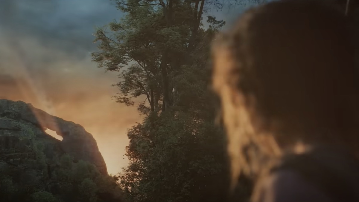 Nori watches the burst of light from the comet crash on The Rings of Power