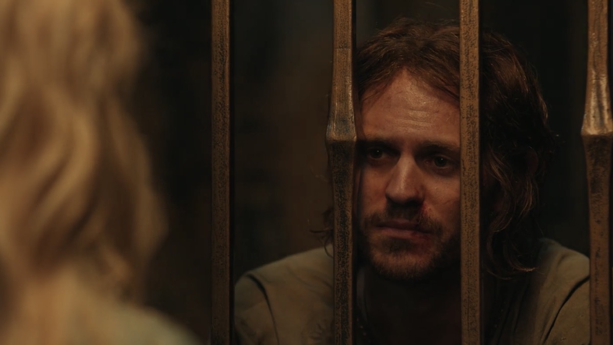 Halbrand behind bars on Númenor talks to Galadriel on The Rings of Power