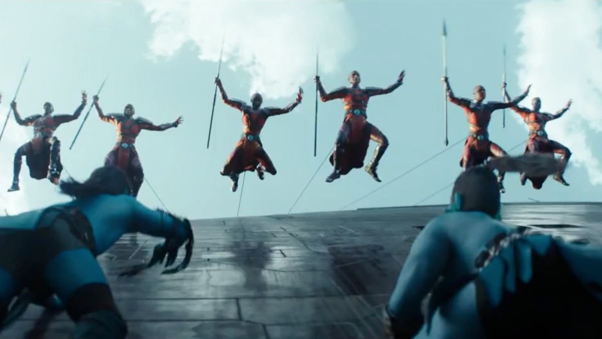 photo of the dora milaje jumping off of the ship to attack while being held by ropes