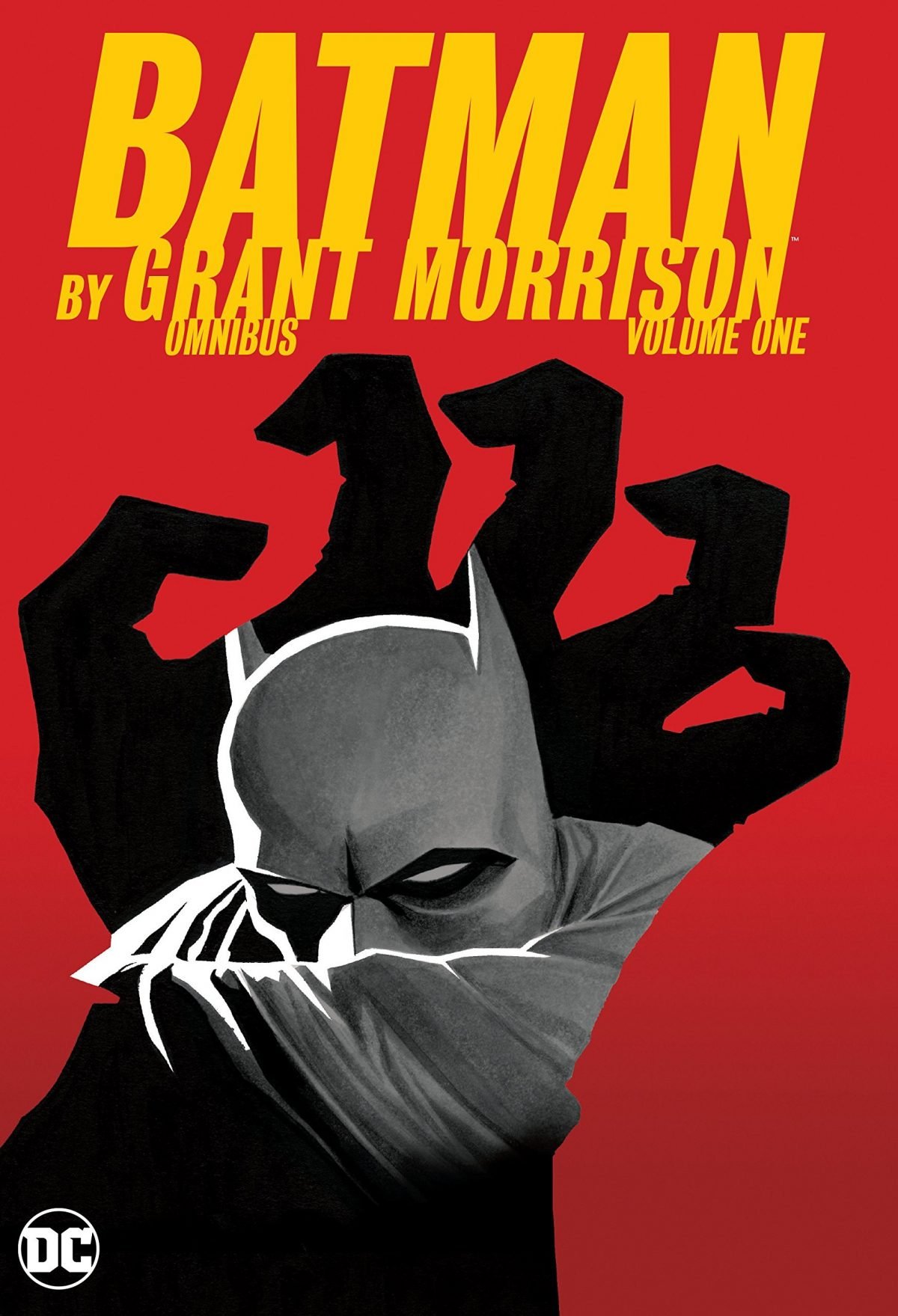 The cover of Batman by Grant Morrison Omnibus vol. 1 shows a shadowy hand reaching for Batman.