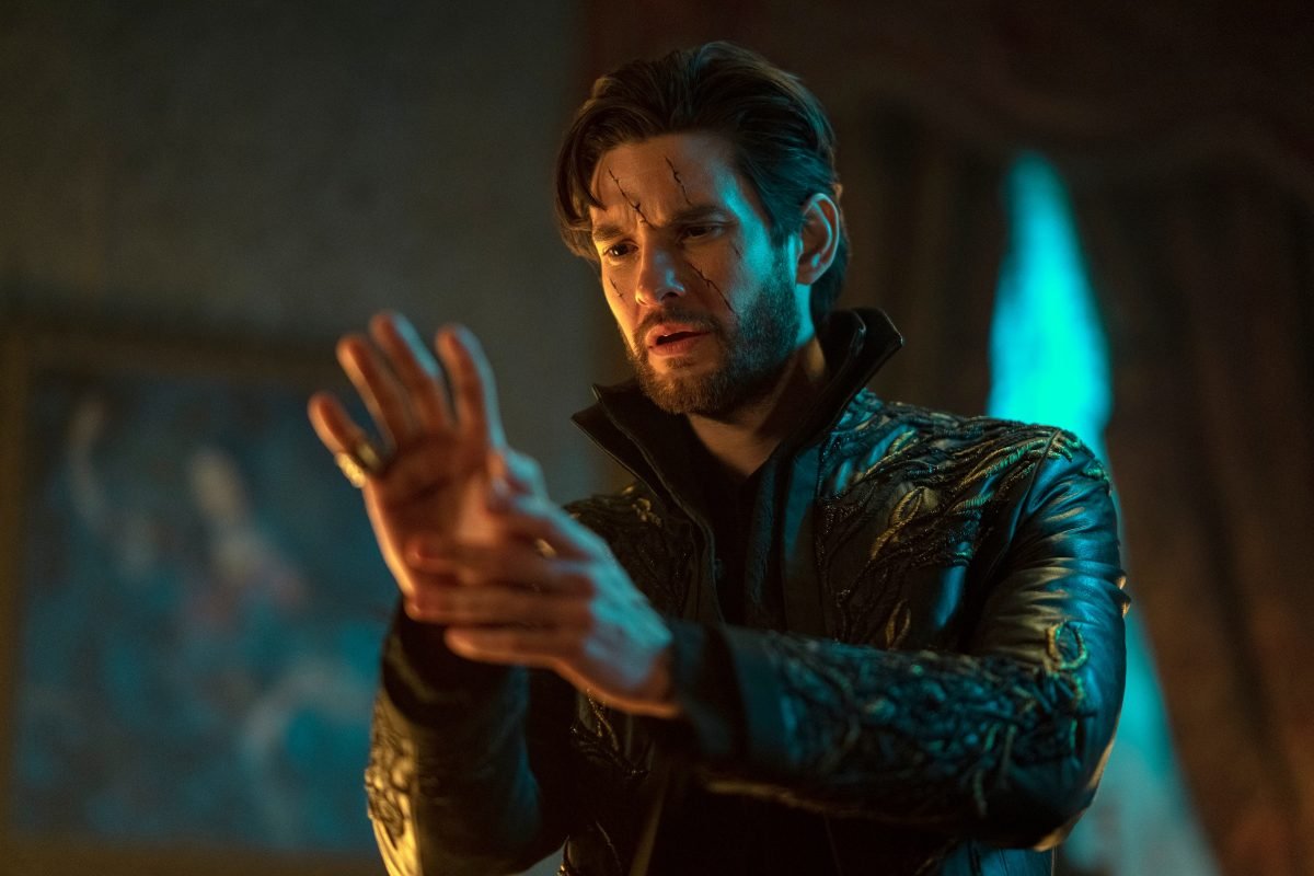 General Kirigan, the Darkling, looks at an injury on his hand in the Shadow and Bone season two trailer