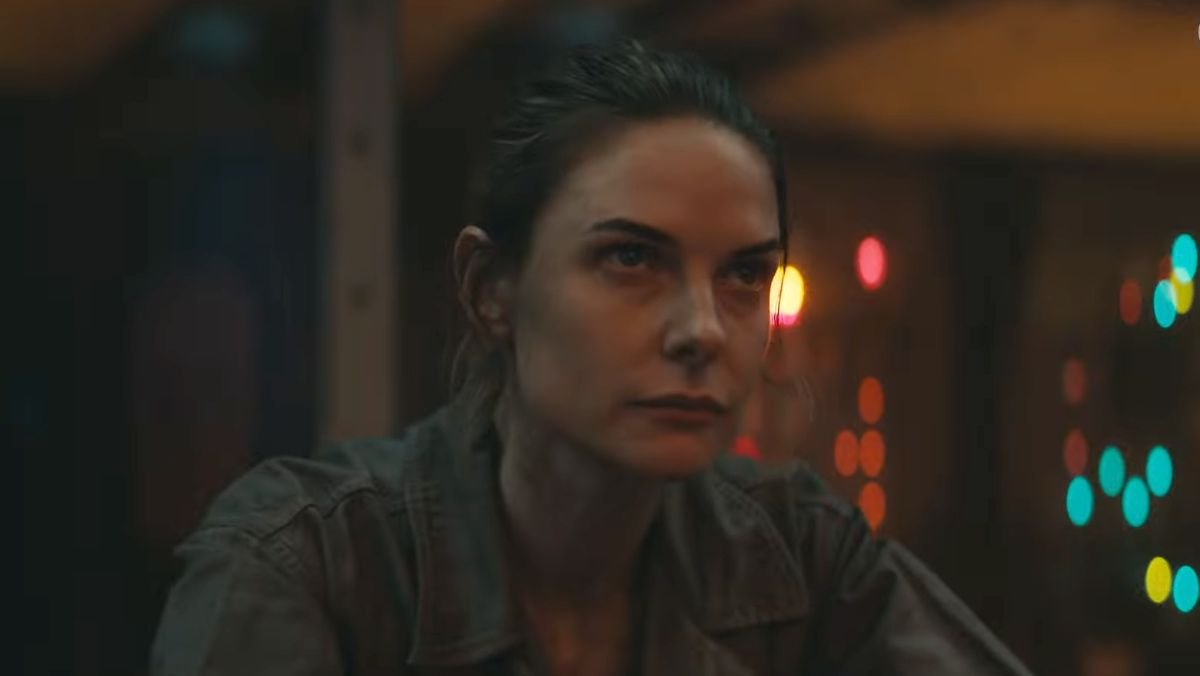 Rebecca Ferguson sits in a control room in Silo trailer