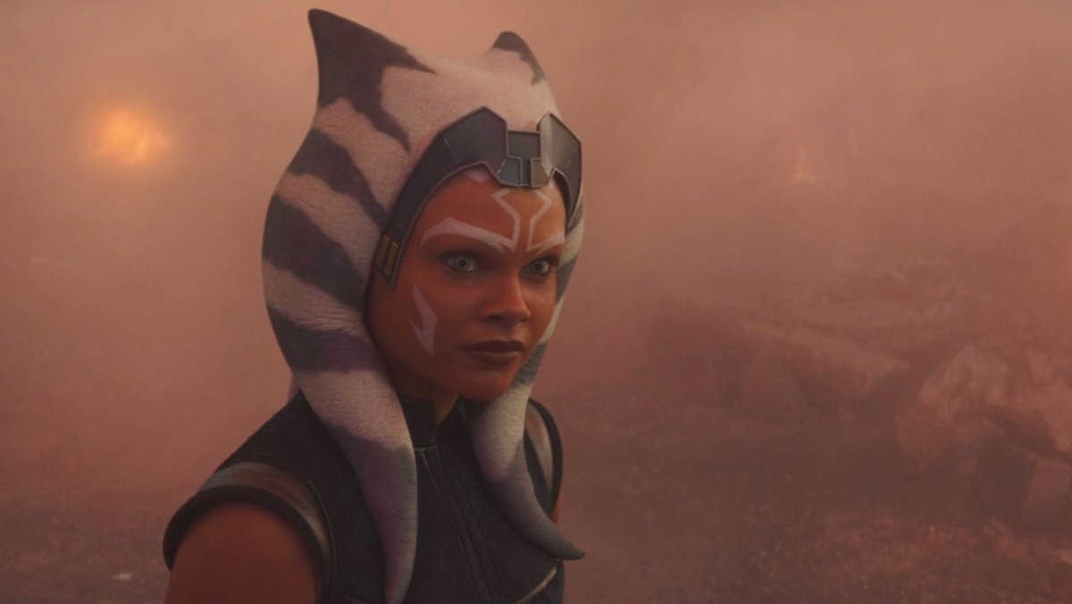 Young Ahsoka Tano surrounde dby orange smoke and mist