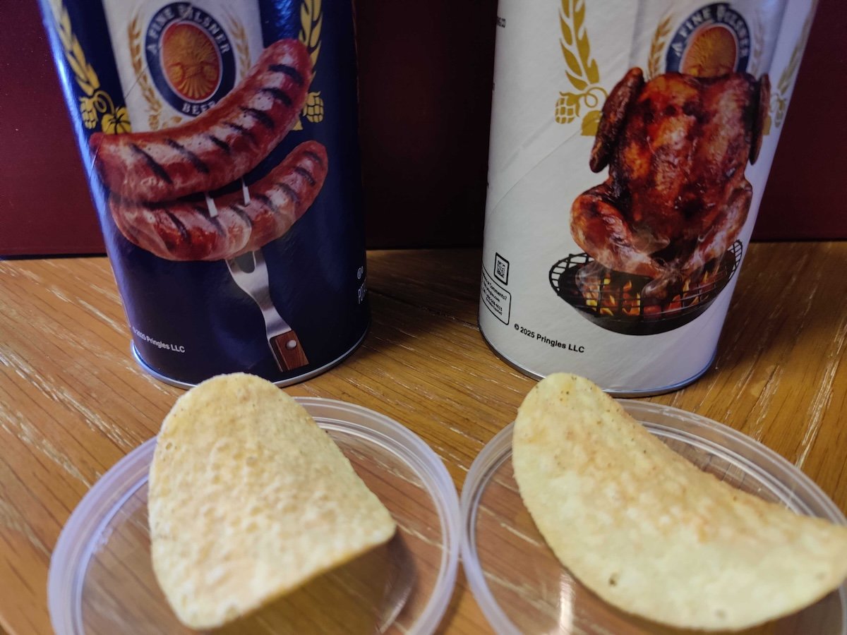 Two single potato chips in front of their Pringles cans