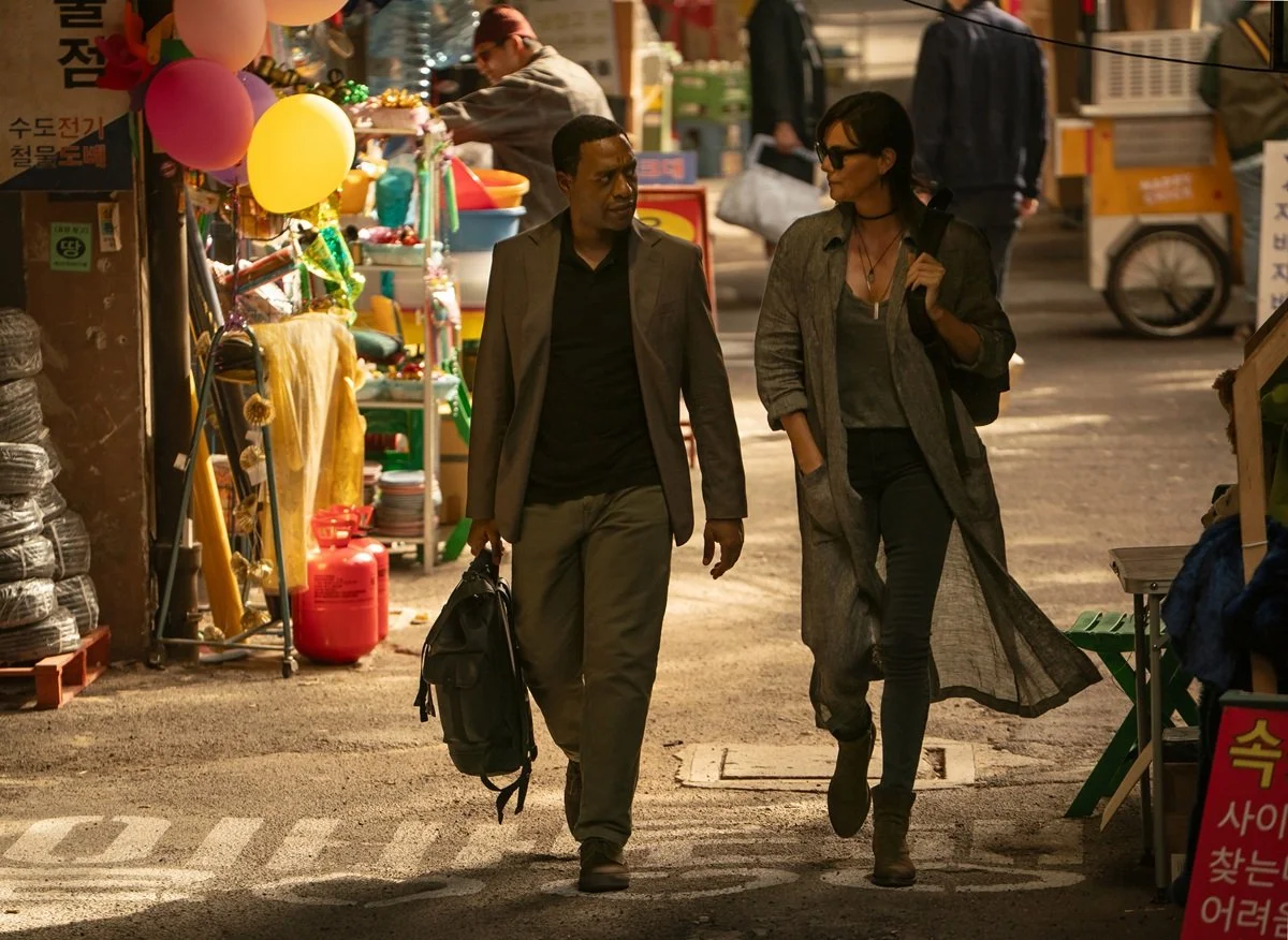 Charlize Theron and Chiwetel Ejiofor take a walk in The Old Guard 2.