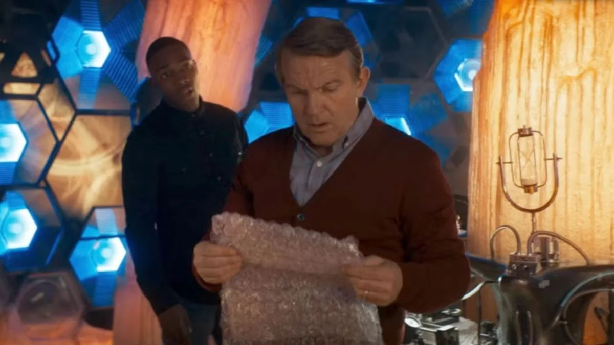 image of graham from doctor who holding bubble wrap which has a weird history where it was also wallpaper