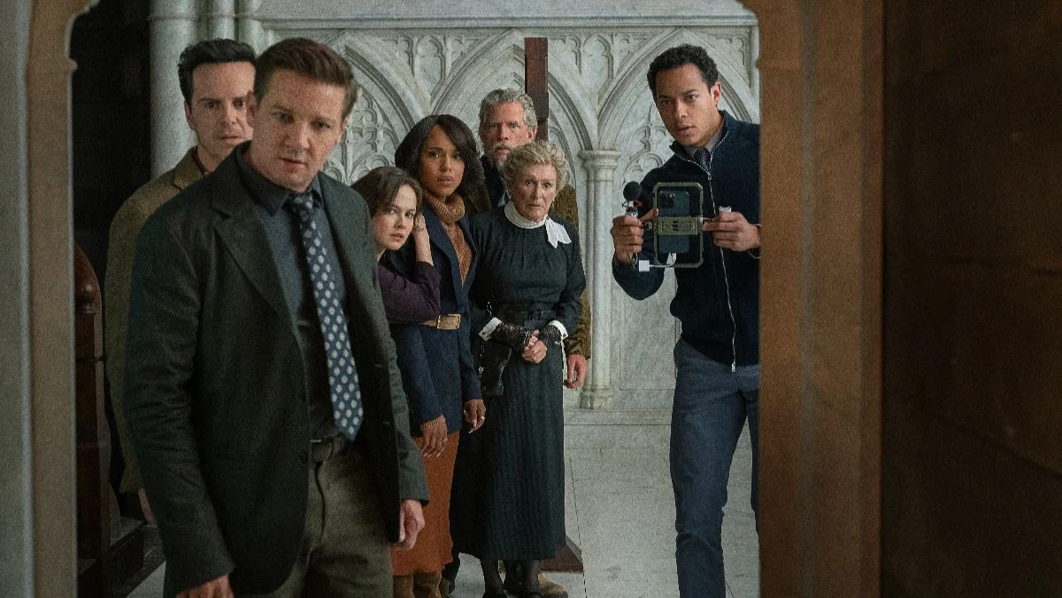 image from wake up dead man knives out trailer of people looking into a closet with shock