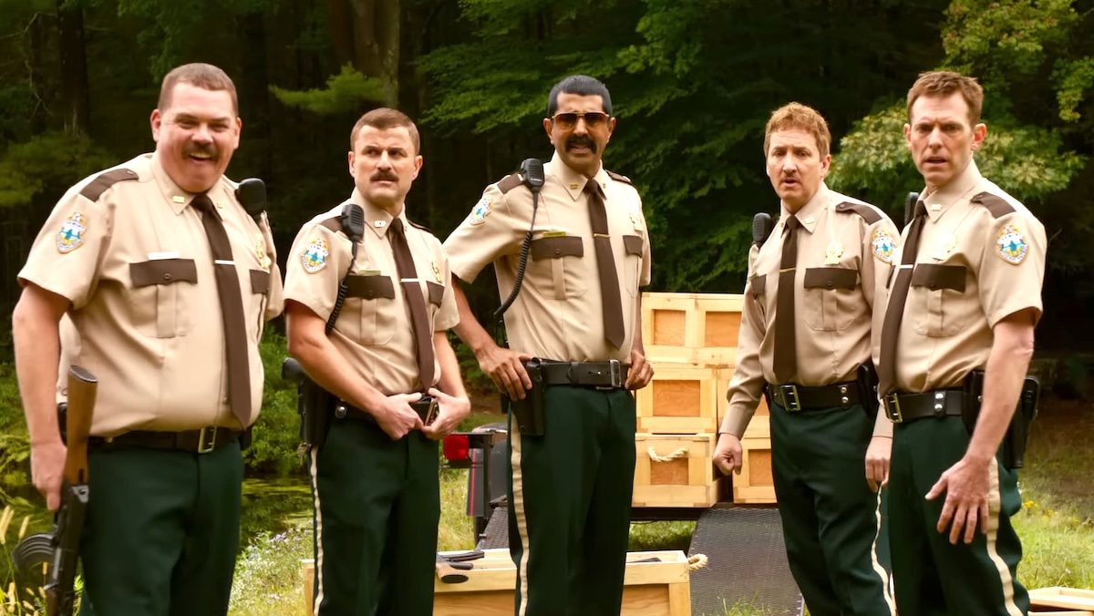 Broken Lizard dressed as cops in the woods in Super Troopers 2