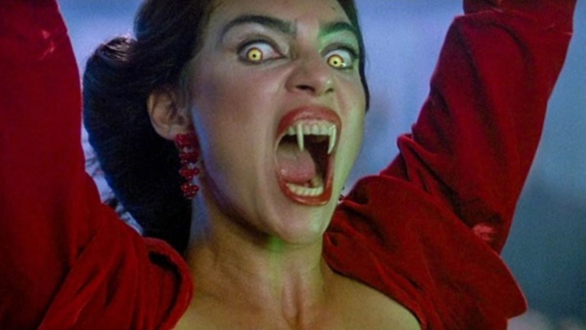 image of regine from fright night part 2 with her fangs out